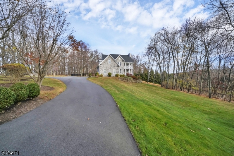 This custom colonial is located on a flag lot, where privacy abounds!