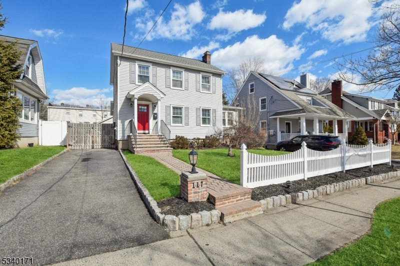 Vinyl sided, long blacktop driveway. Exterior landscape lighting. White picket fence. Wood fence back yard.  IN-TOWN location