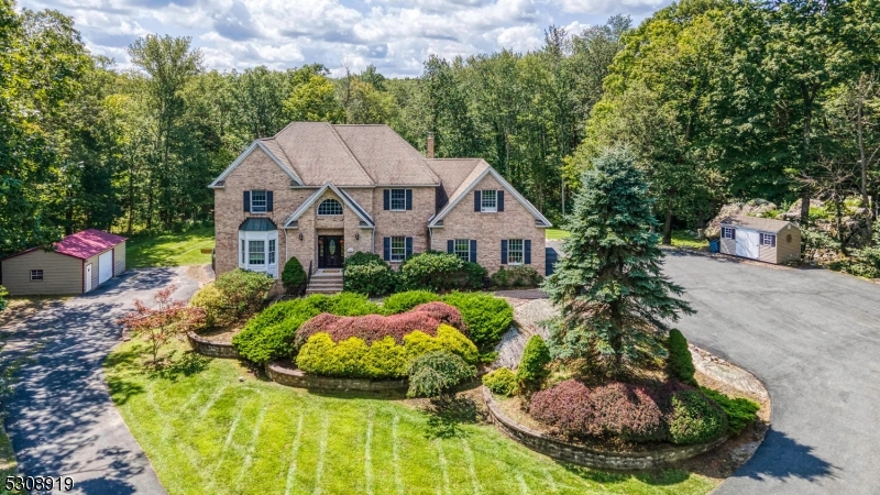 This stately center hall colonial has so much to offer!  Privacy abounds as this exquisite home sits on just shy of 6 acres in a cul-de-sac community of estate homes on similar tracts and this home also backs to state land.