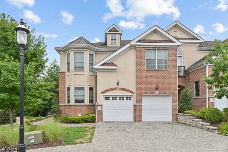 Brick & stucco exterior, paver block driveway