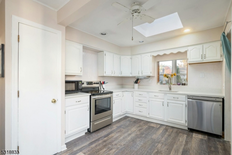 Fantastic kitchen with new granite countertops, subway tile backsplash, stainless steel appliances and new vinyl flooring.