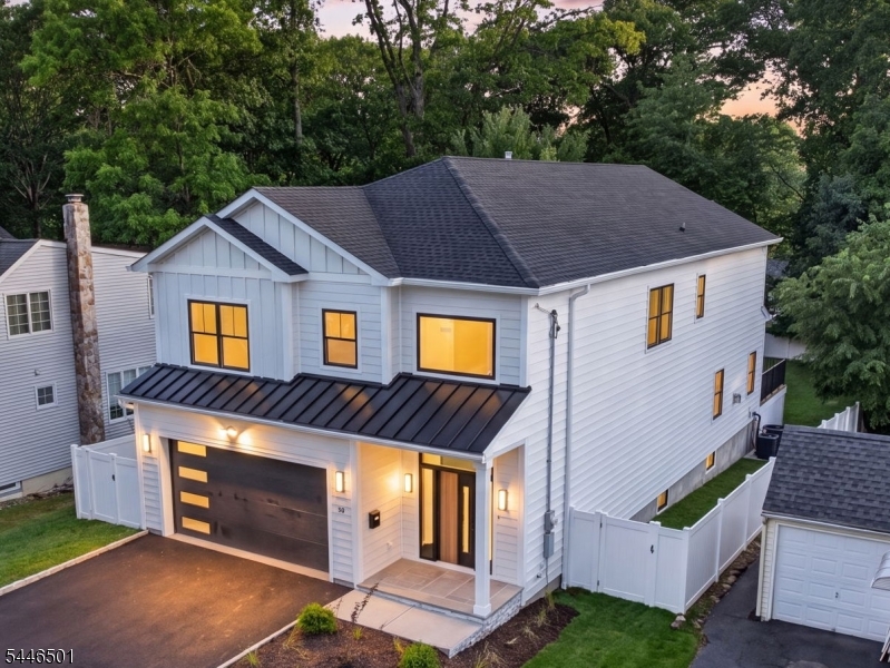 Welcome to this stunning new construction that perfectly blends modern elegance with thoughtful design across three spacious levels.