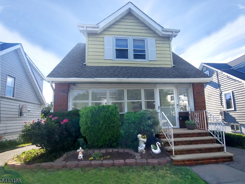 Great Curve Appeal Classic red brick exterior with a well-maintained roof in excellent condition.