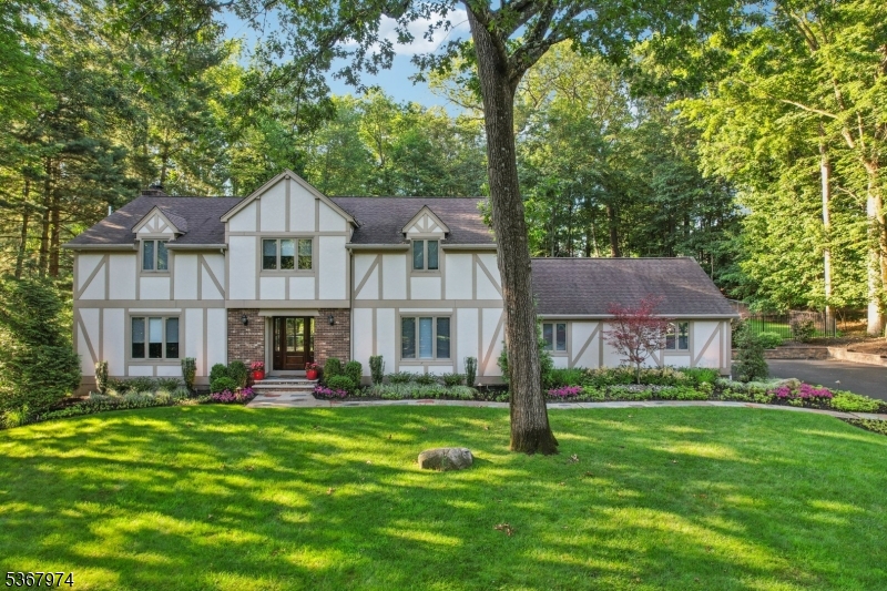 Welcome home to this meticulously maintained 4 bedroom 2 full and 2 half bathroom Tudor style residence.