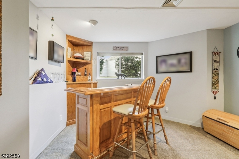 Lower Level Recreation Room Custom bar with seating