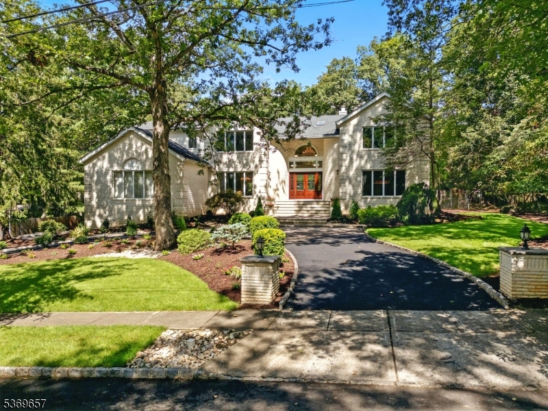 Beautiful circular driveway with lush plantings
