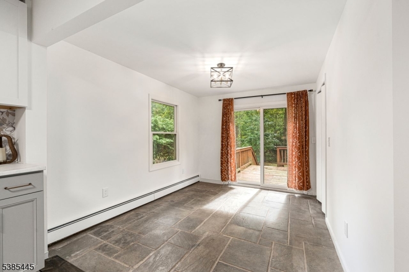 Stone Floor Dining Area with sliders to deck