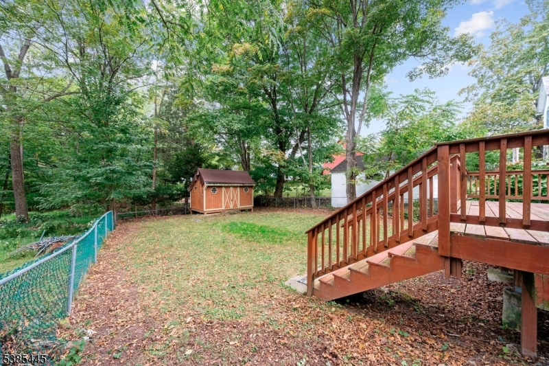 Deck with stairs to fenced yard