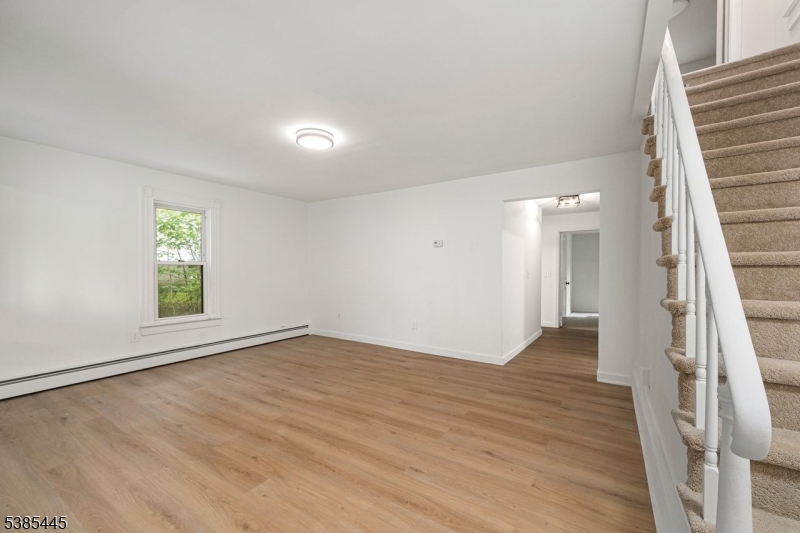 Living Room stairs to additional 3 bedrooms and another full bath
