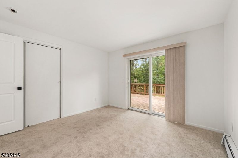 1st Floor Bedroom Sliders to deck; open to Full Bath