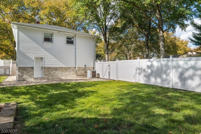 side yard with door to garage