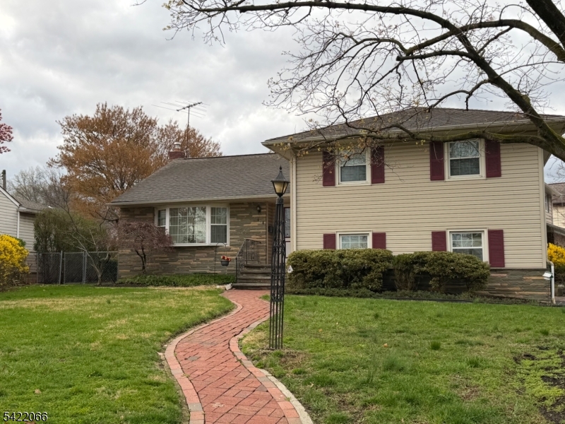 Custom paver walkway welcomes you into this pretty 3 bedroom split level with fieldstone front & aluminum sided exterior home in the Fairway Park section of Union