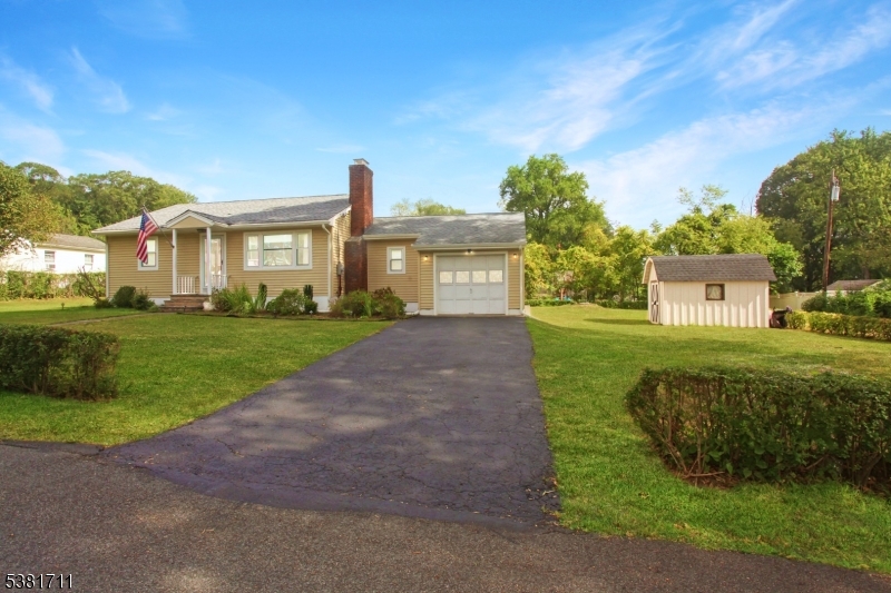 EXTRA LARGE Lot! Attached garage. New Siding, Windows and 8 yr young Roof. Plenty of Parking!