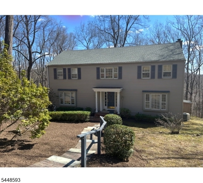 9 East Fox Chase Road, Chester Welcome Home to this beautiful Center Hall Colonial located on a 2 acre wooded lot!