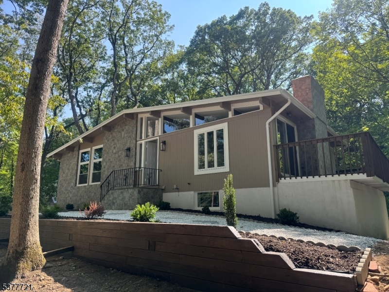 Welcome home to this beautifully renovated 4 bedroom, 3 bathroom Raised Ranch, perfectly nestled on a private wooded lot in the heart of Wayne.