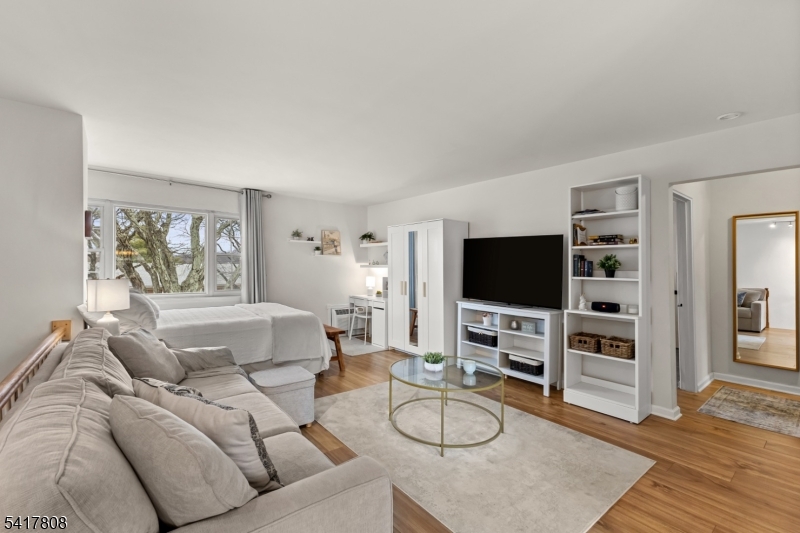 Spacious Living room with large windows and plenty of sunshine.