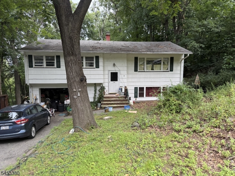 Charming Bi-Level home offering 4 bedrooms, multiple living spaces, and a bright, welcoming main level.