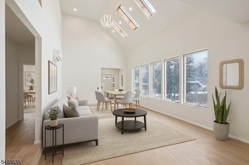 Living Room / Dining Room Envision yourself in the cozy living room / dining room space which provides a comfortable space for hosting gatherings and enjoying intimate meals. (staged photo)