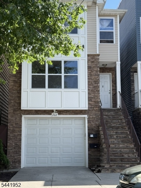 First floor apartment one car garage and parking spot ( fits a small/compact vehicle )