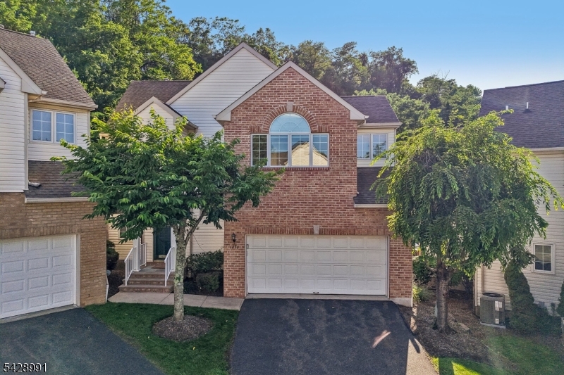 Front View Center Hall Colonial with oversized 2 car garage