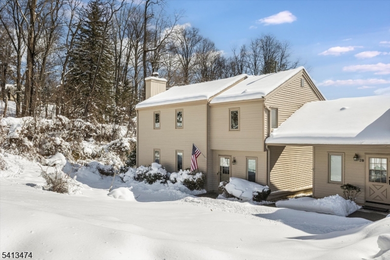 Front View End Unit Nestled in the back of the complex bordering the woods