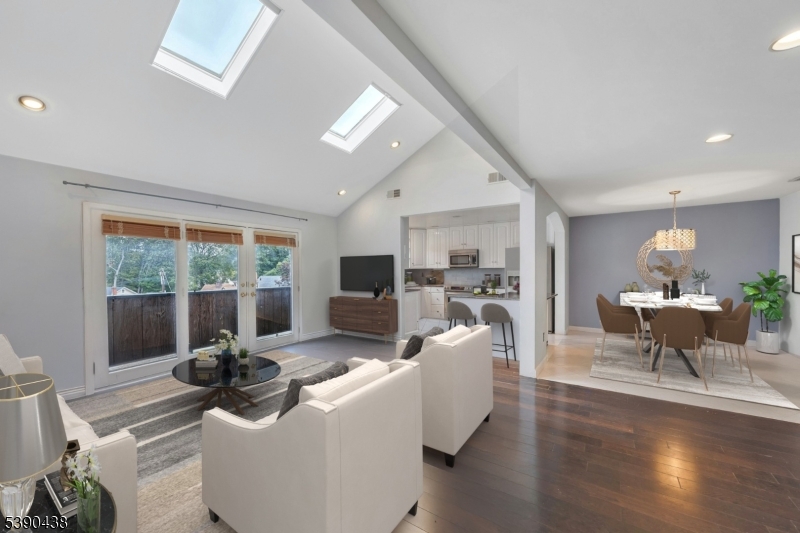 Living Room Living room with skylights leads to balcony