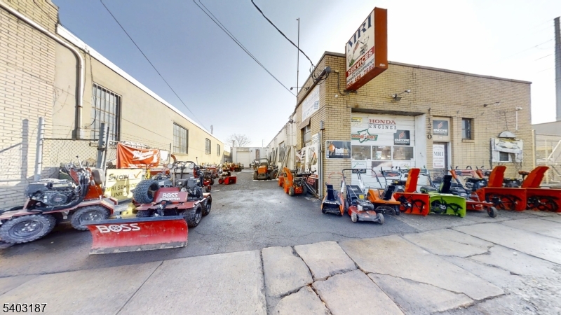 2 Units - See 2 sets of Floor Plans  Commercial building at 1220 E Elizabeth Ave, Linden with two units totaling 3,500+ SF, not in a flood zone. Front: 1,900 SF retail w/ garage. Rear: 1,660