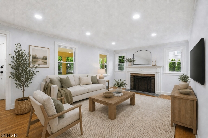 Living Room Bright and welcoming living area with decorative fireplace and comfortable entertaining area.