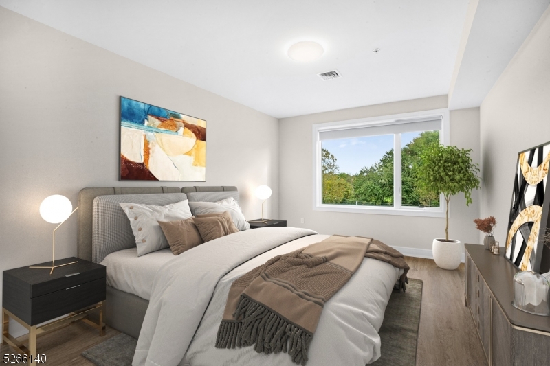 Staged Bedroom Virtually staged- Wall unit will be under the window as in the photo of the living room