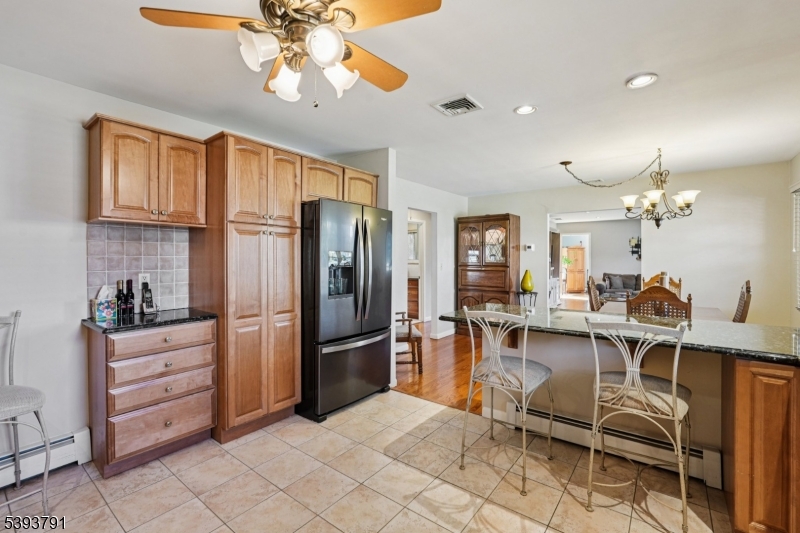 Kitchen The kitchen offers plenty of custom cabinetry, perfect for all of you kitchen storage needs.