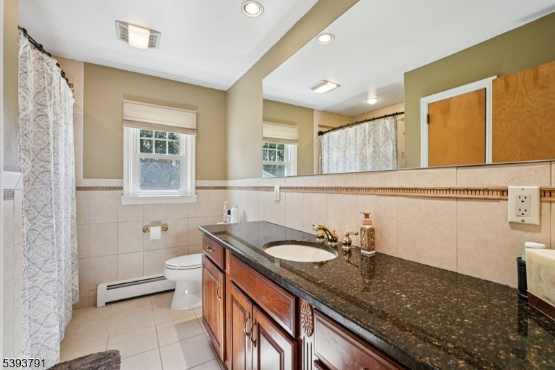 Full Bathroom The full bathroom is equipped with a tub shower and large storage vanity.