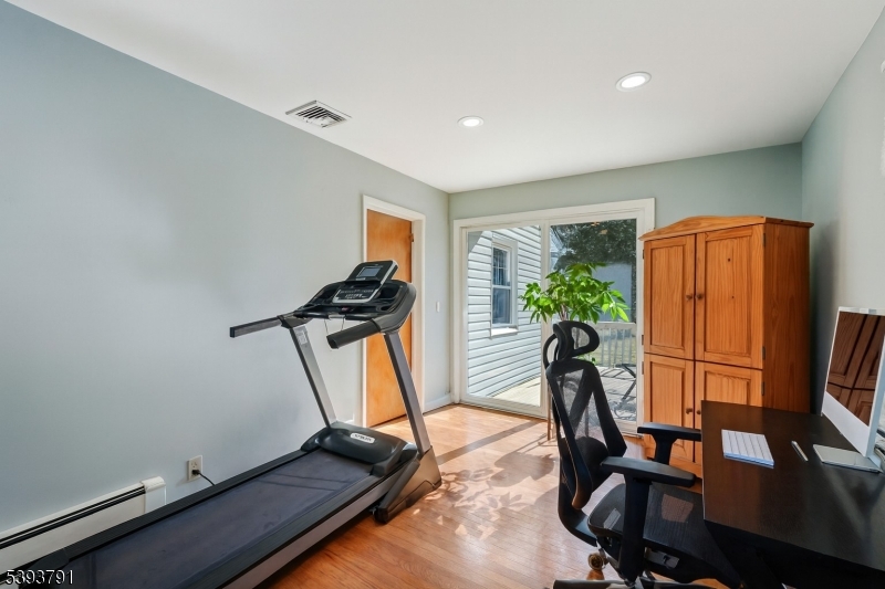 Den The den is the ideal space for a third bedroom or comfortable home office. Sliding glass doors lead out to the rear deck.