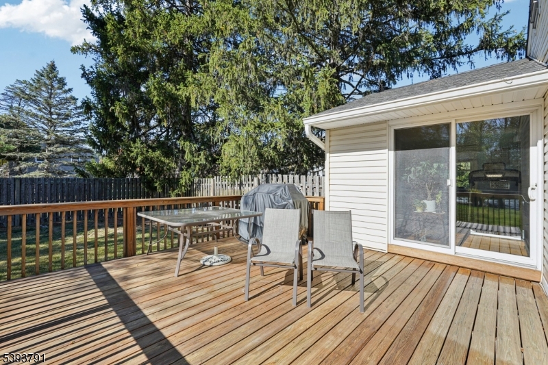 Rear Deck From the den, step outside to the generous rear deck offering an ideal space for outdoor grilling and entertaining.