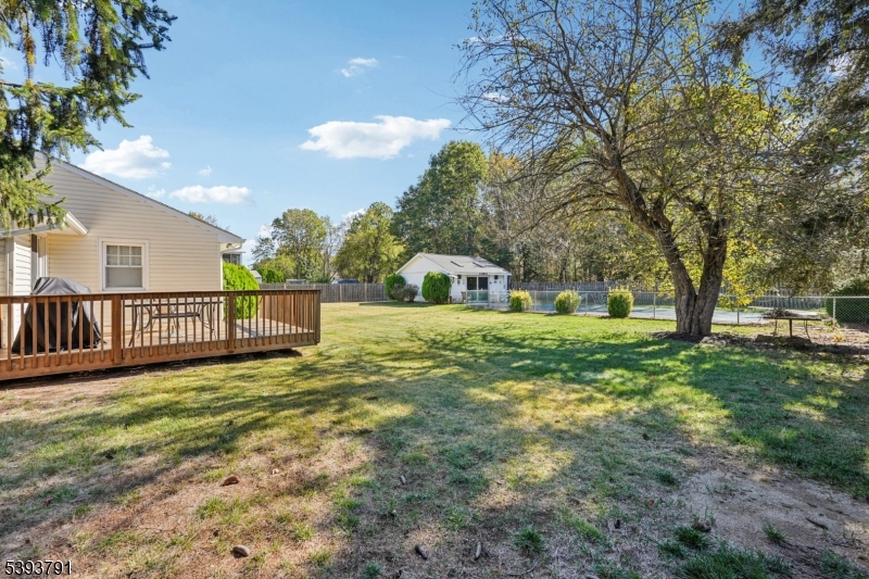 Backyard The rear deck leads into the large fully fenced in backyard.