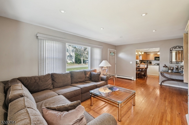 Living Room Step into the spacious living room filled with natural light offering a comfortable atmosphere that invites relaxation and connection.