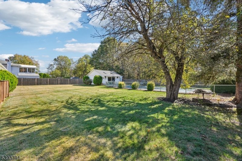 Backyard Ample driveway parking and a prime location near NYC transportation, shopping, and dining make this home the total package.