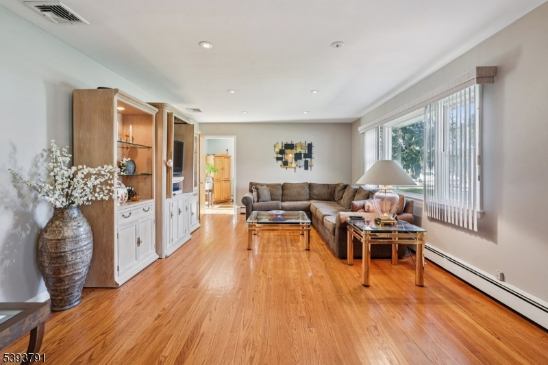 Living Room Large window allows beautiful natural light to fill the space.