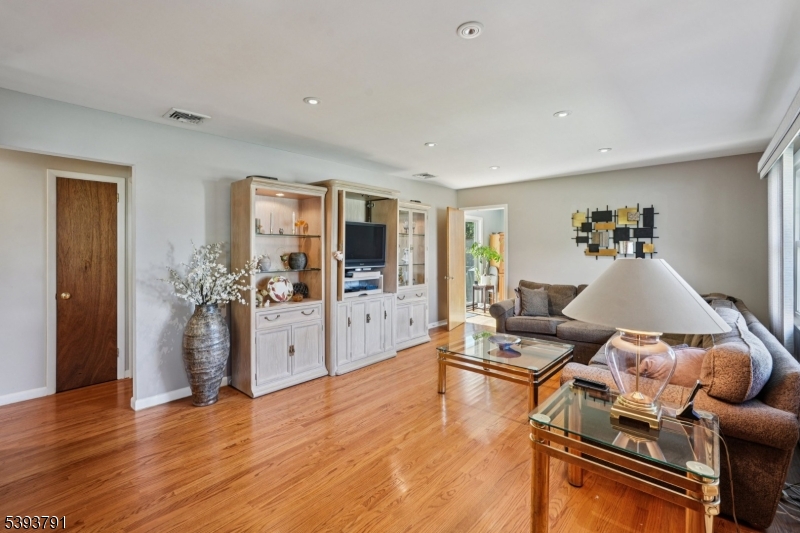 Living Room Large cased opening from the living room flows seamlessly into the dining room.