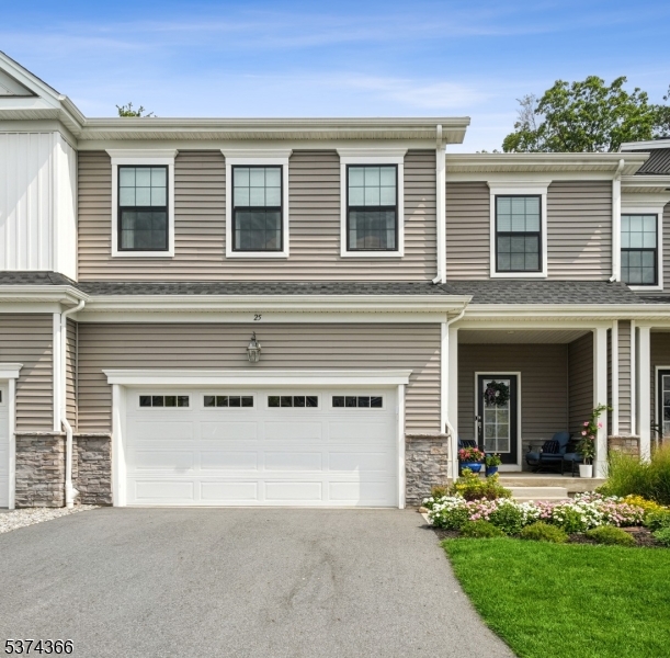 Two car garage direct entry in to home on 1st floor. Large driveway two car wide