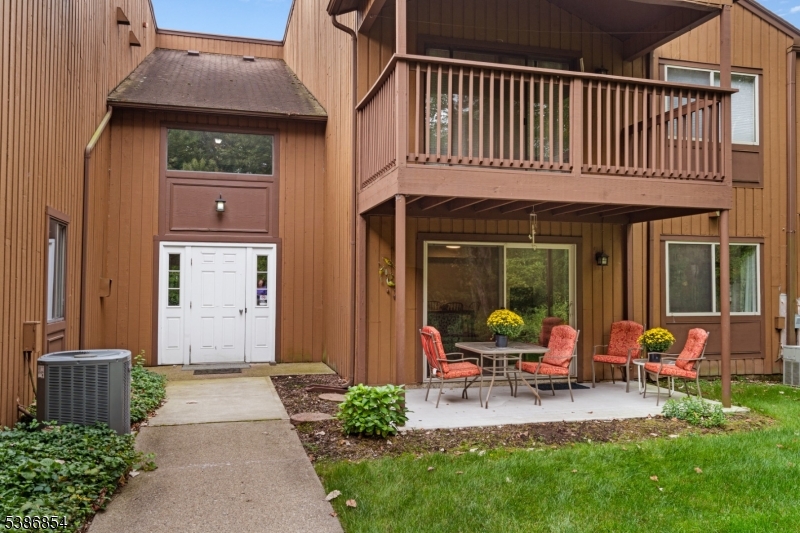 The patio belongs to #99 and the outer entry door opens to the interior foyer