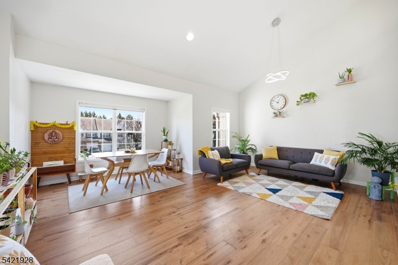 Main Living Area HIgh Ceilings, Stunning Wood Floors and Tons of Natural Light
