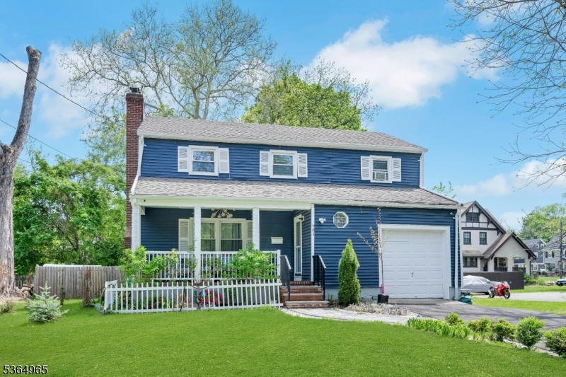 This beautifully maintained Colonial offers undeniable curb appeal with its striking navy-blue exterior, charming front porch, and manicured lawn. A warm welcome awaits in this picture-perfect setting?ideal for morning coffee or evening unwinding.