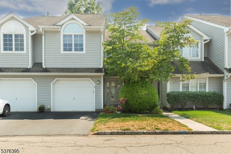 Welcome to Montville Chase! This charming townhome features a private driveway, attached garage, and inviting entry framed by mature landscaping and lush greenery--offering great curb appeal in a sought-after community setting.