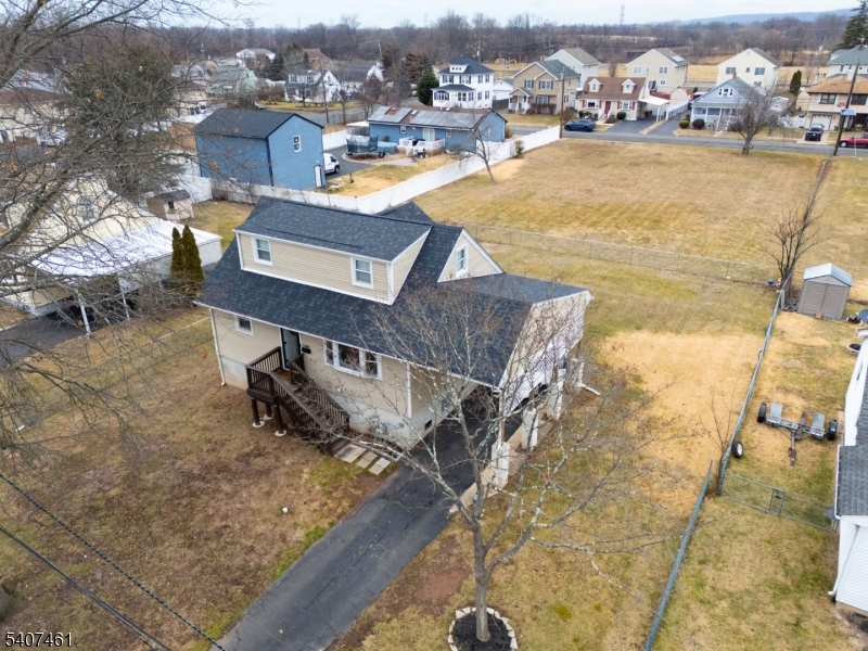 FRONT Aerial view Aerial view of the front fo the home. The vacant lot visible at the rear is not part of the property.