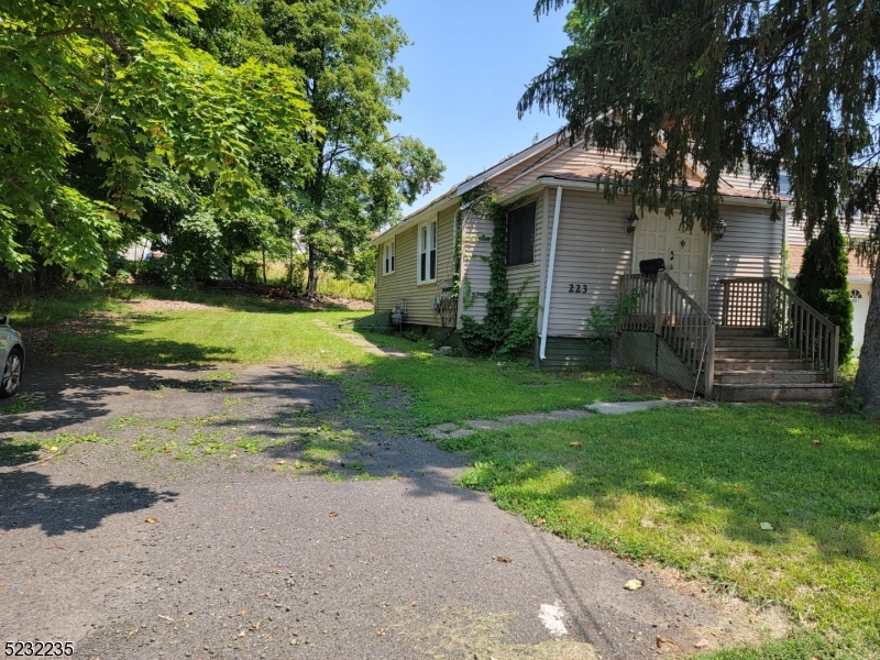 Front with Parking and Private Side yard Backyard.
