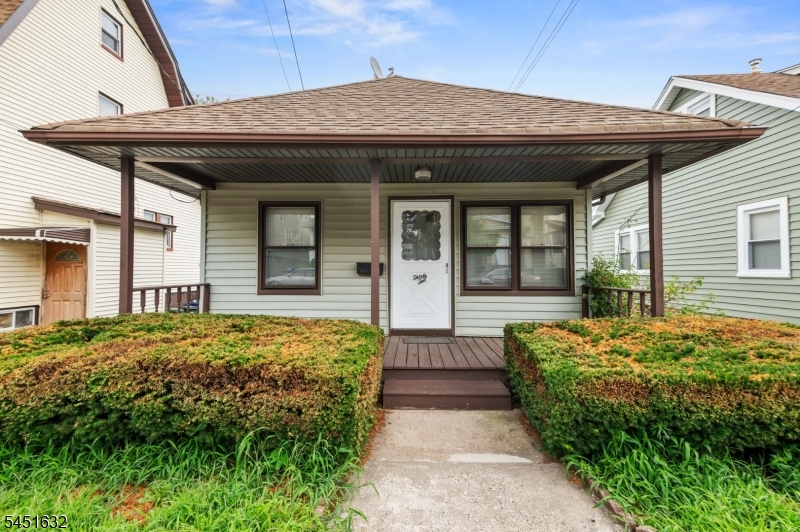 Attractive front exterior with covered porch for relaxing. Welcoming entrance with a great curb appeal.