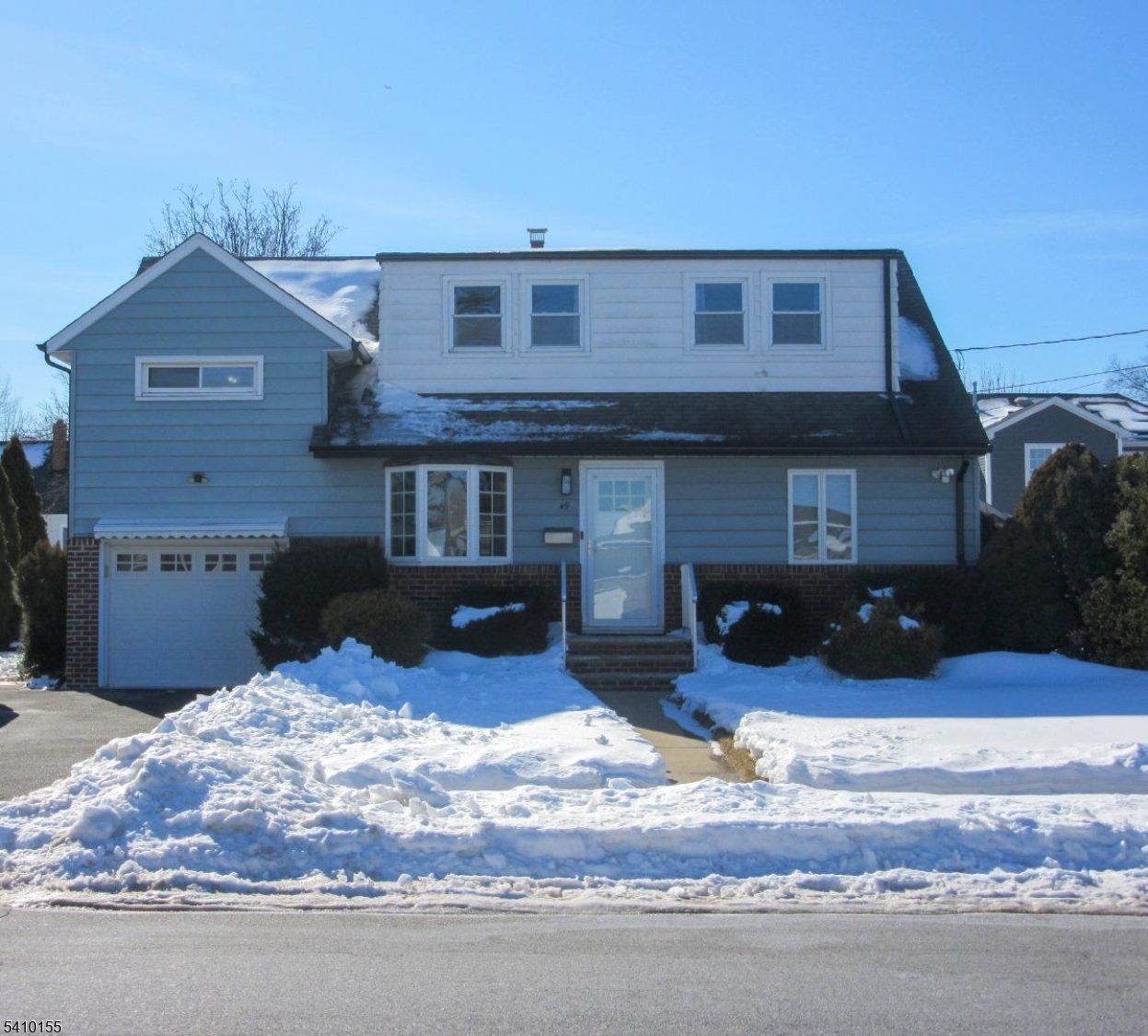 Front facade showcasing balanced architecture and attached garage convenience.