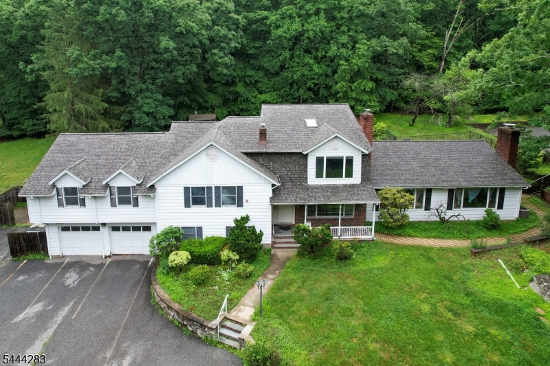 Set on 2.67 acres, this expansive custom split level home offers approximately 5000 sq ft