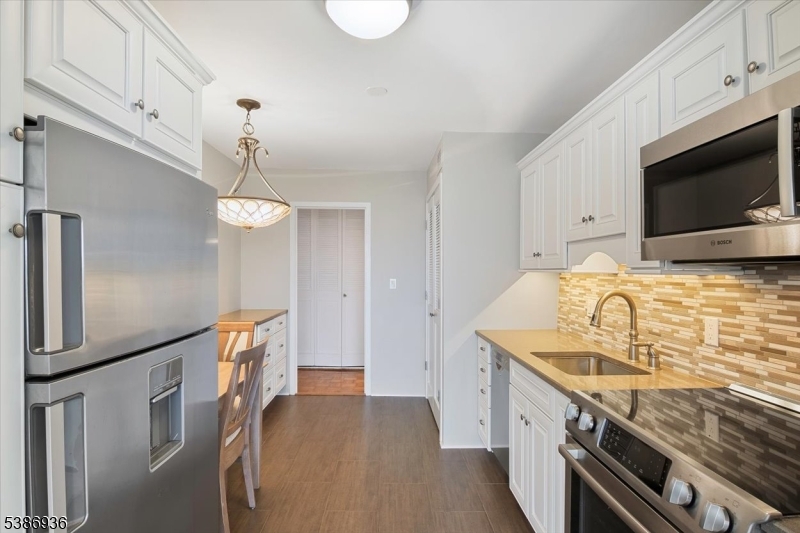 KITCHEN Modern kitchen with stainless steel appliances.