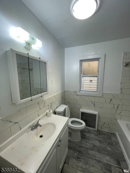 Full Bathroom Full bathroom featuring a modern design and a bathtub, providing both style and functionality.